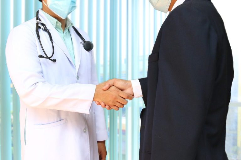 Doctor and patient shaking hands